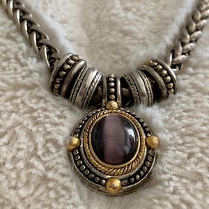 Silver and gold necklace with purple stone